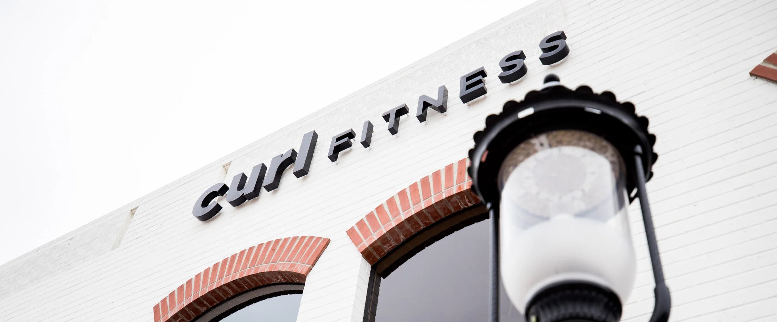Curl Fitness Costa Mesa logo